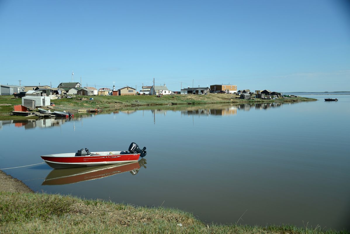 16B Idyllic Scene Of A Boat And Buildings Reflected in The Water On Arctic Ocean Tuk Tour In Tuktoyaktuk Northwest Territories